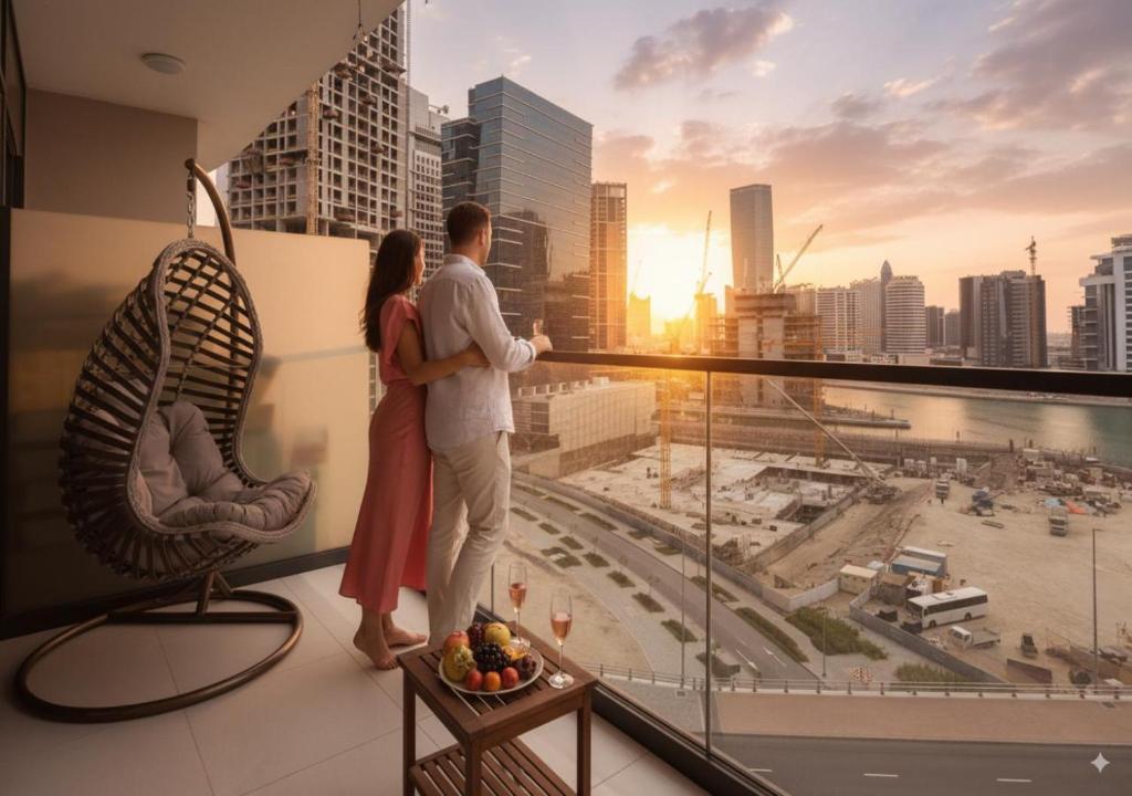 Professional couple on balcony with Dubai skyline